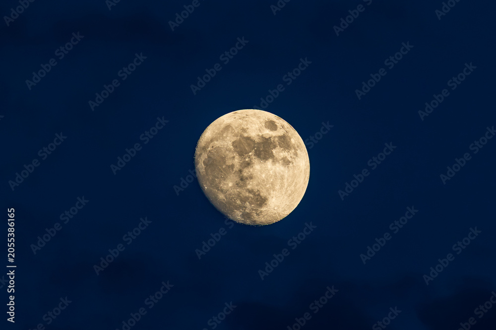Fototapeta premium Detailed waxing gibbous moon against deep blue evening sky, Italy, Roseto degli Abruzzi, 28 May 2026