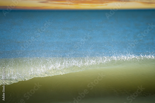 Wave Crashing at Sunset