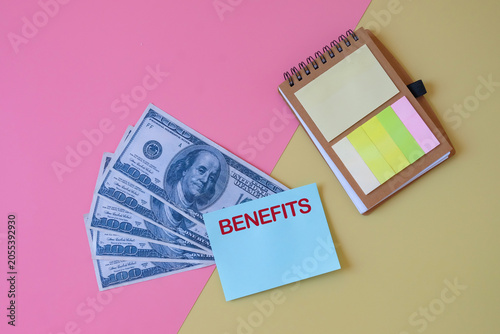 Bank note with paper note on two tone background.