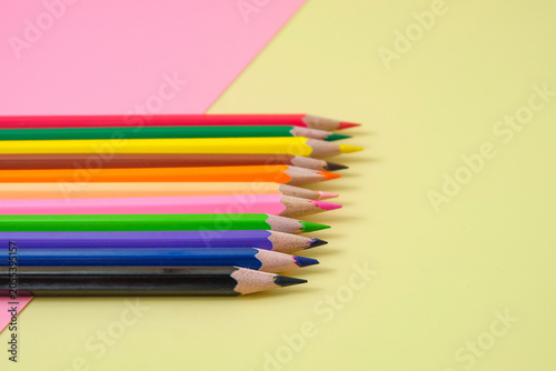 Colored pencil set on two tone background.