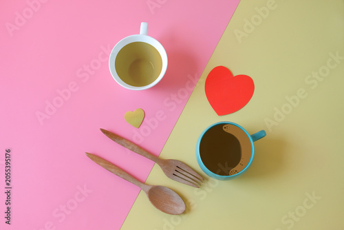 Cup of tea and coffee with red heart on  two tone background.