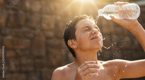 Heat stroke prevention hydration outdoor child cool water splash summer sun safety concept. emergency risk health warning. safety temperature protection, dehydration danger sun summer