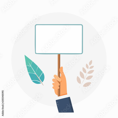 Hand holding blank protest sign with leaves