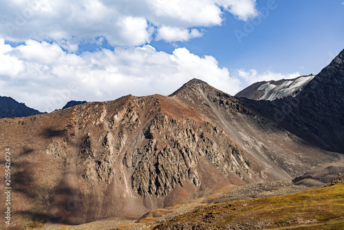 Obraz na płótnie Sunlit rocky slopes and ancient glacial moraine in Kegety Kyrgyzstan