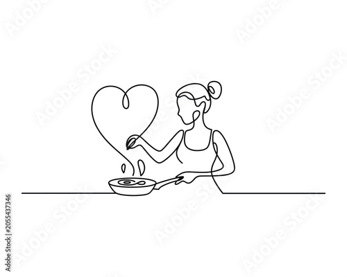 Woman cooking with love and care in the kitchen with heart