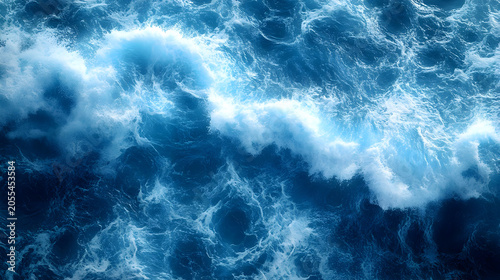 Ocean waves crashing blue water surface.