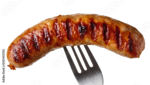 Cuadro en lienzo Isolated delicious grilled sausage on a metal fork, perfectly cooked and ready to serve