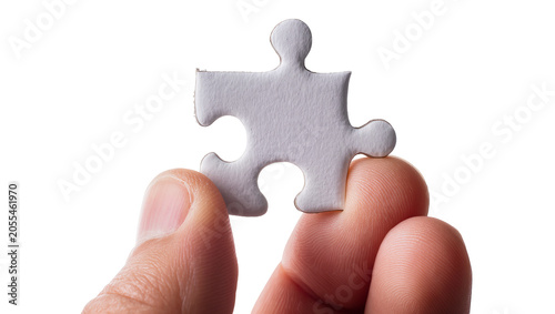 Cuadro en lienzo Isolated person holding one white jigsaw puzzle piece, symbolizing problem solvi