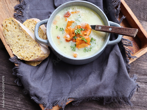 Creamy soup with mushrooms chanterelles and herbs