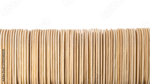 Quadro su tela Isolated row of natural wooden craft sticks arranged vertically, creating a text
