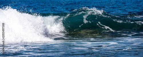 Panel kuchenny z motywem Glowing sea waves shimmer in daylight. Ocean wave rise high. Bright sea waves background. Ocean wave roll on the beach. Blue green sea waves patterns. Ocean waves of nature.
