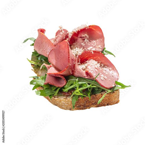 Roast beef bruschetta with arugula isolated
