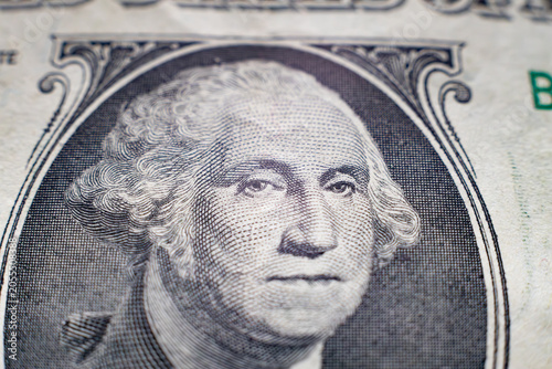 Extreme close-up of George Washington portrait on one US dollar bill