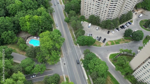 Aerial shot of Mississauga, Ontario, Canada on an overcast summer afternoon. Overhead shot looking down on Mississauga Valley Boulevard, along a stretch of condominium and apartment buildings.