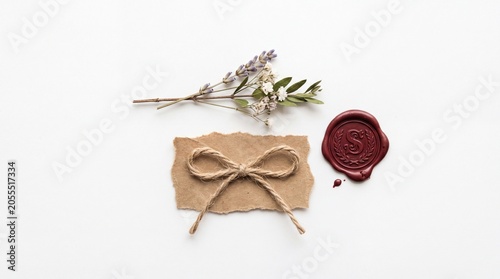 Vintage paper note with rustic twine bow and wax seal