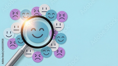 Magnifying glass focusing on a smiling emoji surrounded by various facial expression icons, showcasing digital smiley while feeling for modern illustrations > digital art >