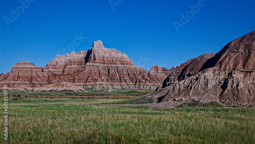 Badlands National Park dramatic geological formations under a clear blue sky