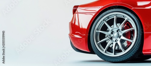 Red sports car with silver rims on a white background.