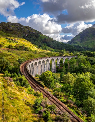 Majestic stone railway viaduct through lush valley