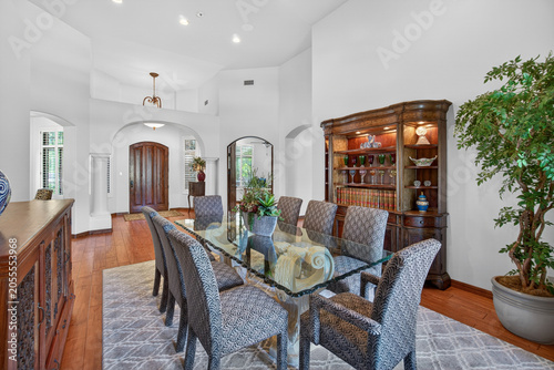 Elegant dining room with glass table and chairs