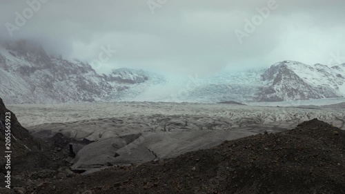 Moody views of Jokulsarlon glacier with overcast clouds and mountains