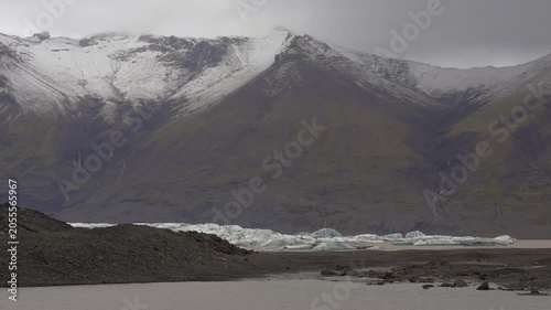 Jokulsarlon glacier with overcast skies and mountain views in Iceland