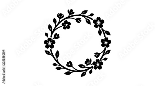 Black floral wreath with leaves and flowers.