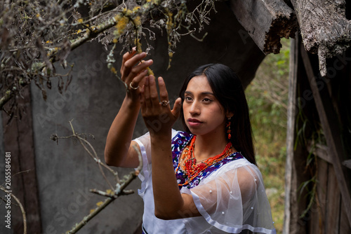 Photography Indigenous woman performing ritual connecting with nature and tradition