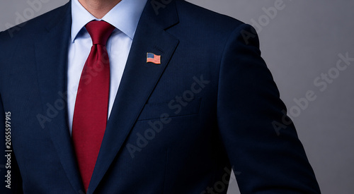 Foto Man in a sharp navy blue suit, light blue dress shirt, and a vibrant red tie with an american flag lapel pin