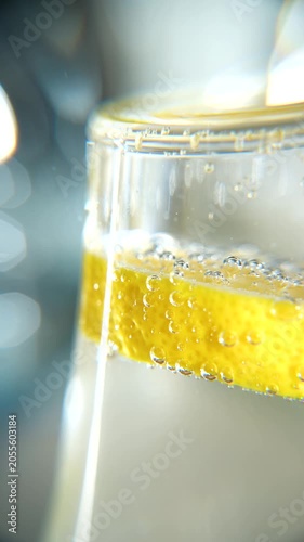 Macro of air bubbles on a lemon in a glass of water