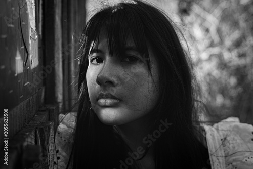 Konstfotografi Young woman showing contemplative emotion in black and white