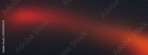 Abstract red light glow on a dark black background texture