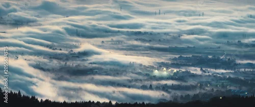 Panel kuchenny z motywem Aerial panorama with atmospheric fog creating a painterly scene over a town at dawn