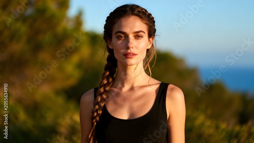 Woman with braided hair in natural setting