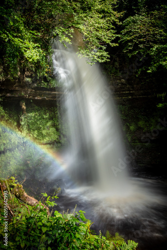 Waterfall in ireland with rainbow