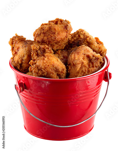 Crispy fried chicken pieces in red bucket