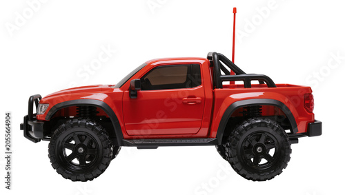 Red remote control pickup truck with large black tires, isolated on transparent background