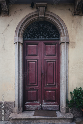 An old entrance door on an Italian street on the island of Sardinia, Italy