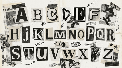Alphabet cutout ransom note style letters on textured paper background