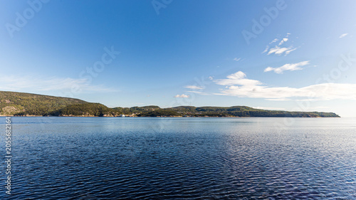 Calm St. Lawrence River with Tadoussac Shoreline, Quebec, Canada