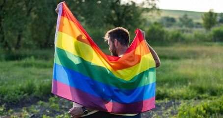 couple holding rainbow flag for pride month