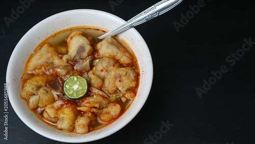 Принти на полотні Indonesian Baso Aci with Cuanki and Lime in a White Bowl on Black Background