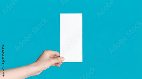 Minimalist Hand Holding White Blank DL Brochure Mockup Against Solid Blue Background