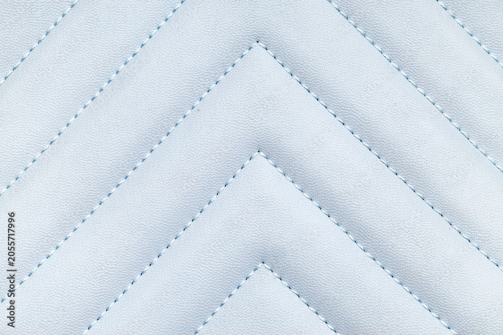 Naklejka premium Light blue quilted leather texture with chevron stitching pattern, luxury upholstery and fashion material background