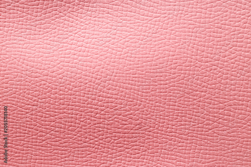 Fototapeta premium Pink leather texture background with detailed grain pattern, abstract material surface for design and fashion concepts