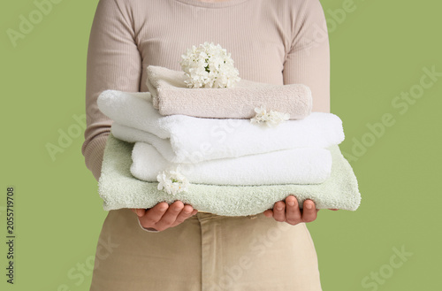 Woman holding stack of fres...