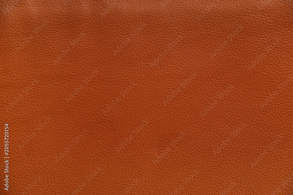 Fototapeta premium Rich brown leather texture background, natural grain pattern, high quality material for upholstery and fashion design