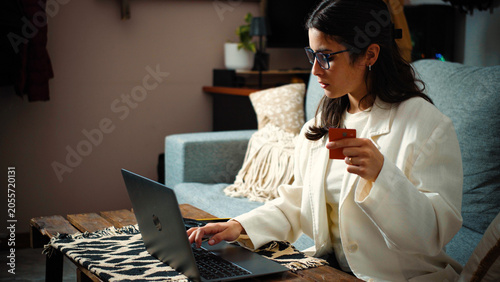 Canvastavla Young Hispanic woman frustrated after her credit card payment is declined while shopping online with her laptop