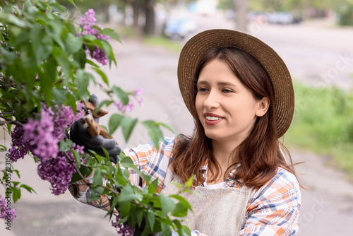 Young woman gardener in str...