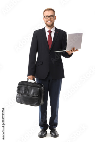 Smiling businessman holding...